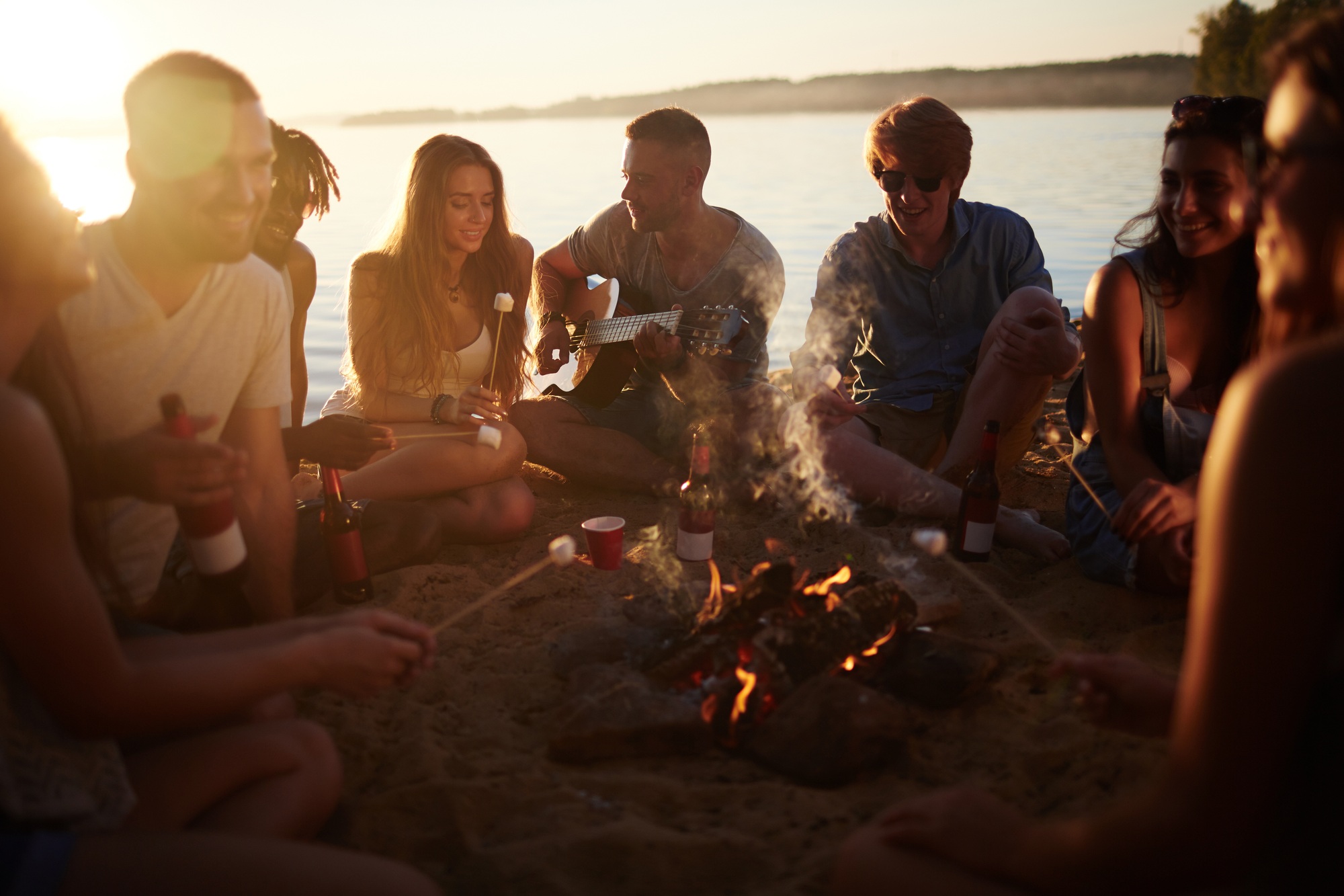 People around a campfire lake tawakoni